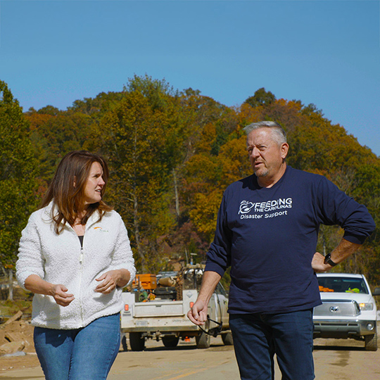 Mike Darrow touring disaster site